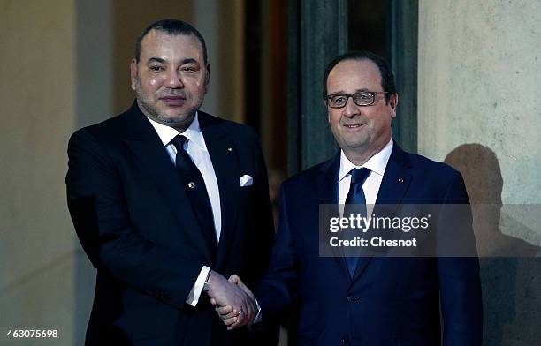 French President Francois Hollande accompanies King Mohammed VI of Morocco after their meeting at the Elysee on February 09, 2015 at the Elysee...