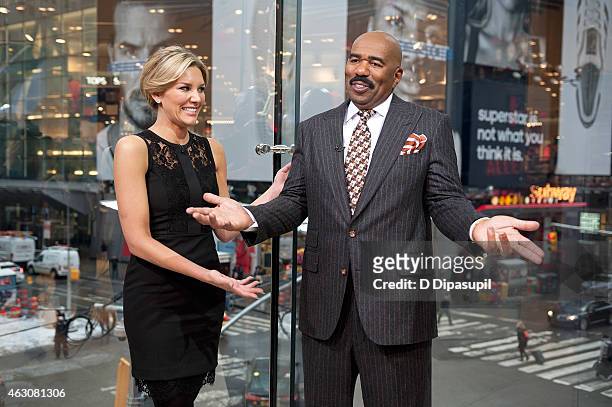 Charissa Thompson interviews Steve Harvey during his visit to "Extra" at their New York studios at H&M in Times Square on February 9, 2015 in New...