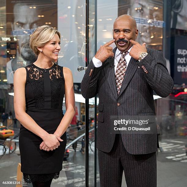 Charissa Thompson interviews Steve Harvey during his visit to "Extra" at their New York studios at H&M in Times Square on February 9, 2015 in New...