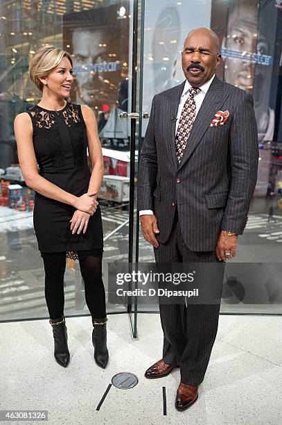 Charissa Thompson interviews Steve Harvey during his visit to "Extra" at their New York studios at H&M in Times Square on February 9, 2015 in New...