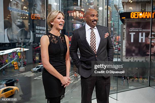 Charissa Thompson interviews Steve Harvey during his visit to "Extra" at their New York studios at H&M in Times Square on February 9, 2015 in New...