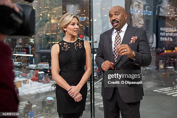 Charissa Thompson interviews Steve Harvey during his visit to "Extra" at their New York studios at H&M in Times Square on February 9, 2015 in New...