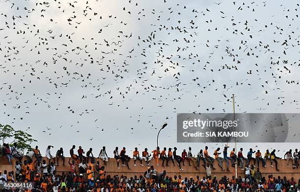 Ivorians attend a welcoming ceremony at Felix Houphouet Boigny Stadium to greet their national football team in Abidjan on February 9 a day after...