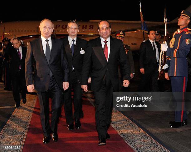 Russian President Vladimir Putin is welcomed by Egyptian President Abdel Fattah el-Sisi at Cairo International Airport for his official visit in...