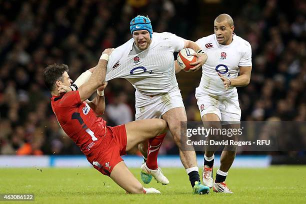 James Haskell of England is hauled down by Mike Phillips of Wales during the RBS Six Nations match between Wales and England at the Millennium...