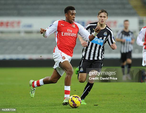 Alex Iwobi of Arsenal takes on Liam Smith of Newcastle during the match between Newcastle United and Arsenal in the Barclays U21 Premier League at...