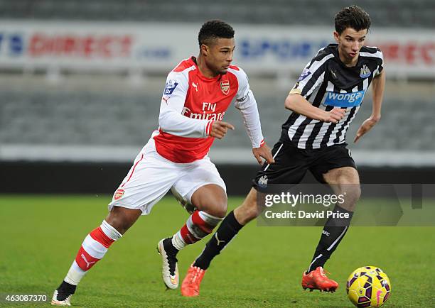 Serge Gnabry of Arsenal turns away from Dan Barlaser of Newcastle during the match between Newcastle United and Arsenal in the Barclays U21 Premier...