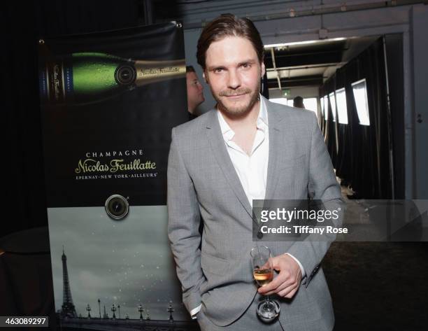 Actor Daniel Bruhl with Champagne Nicolas Feuillatte at the 19th Annual Critics' Choice Movie Awards at Barker Hangar on January 16, 2014 in Santa...
