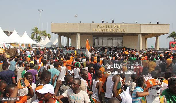 Supporters of Ivory Coast's national football team welcome Ivory Coast's national football team players upon their arrival at Felix Houphouet Boigny...