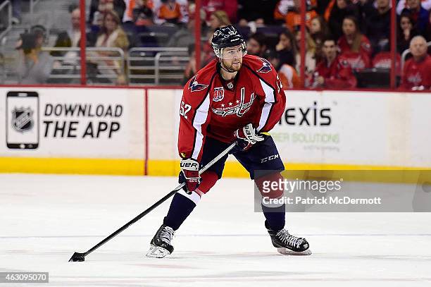 Mike Green of the Washington Capitals controls the puck in the third period during an NHL game against the Philadelphia Flyers at Verizon Center on...