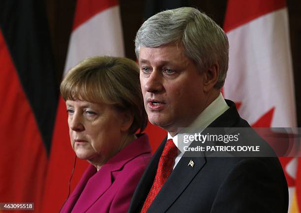 Chancellor Angela Merkel and Canadian Prime Minister Stephen Harper speak at a joint press conference on Parliament Hill in Ottawa, February 9, 2015....