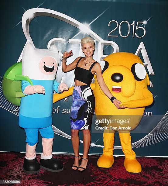 Kate Peck poses alongside Fin the Human and Jake the Dog at the 2015 ASTRA Awards Nominations Photo Call at The Star on February 10, 2015 in Sydney,...