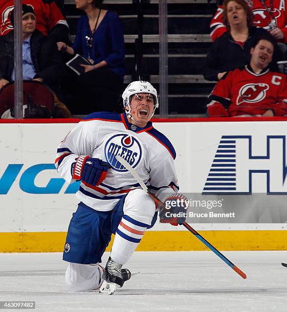 Nail Yakupov of the Edmonton Oilers celebrates his powerplay goal at 12:45 of the second period against the New Jersey Devils at the Prudential...