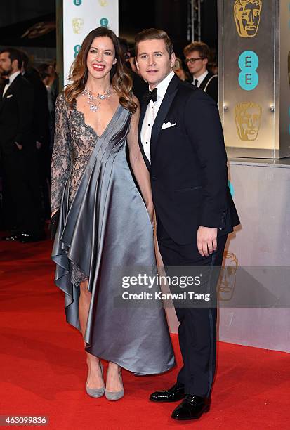 Charlie Webster and Allen Leech attend the EE British Academy Film Awards at The Royal Opera House on February 8, 2015 in London, England.