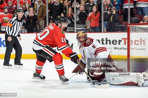 Goalie Mike Smith of the Arizona Coyotes blocks the shot taken by Patrick Sharp of the Chicago Blackhawks in the shoot-out during the NHL game at the...