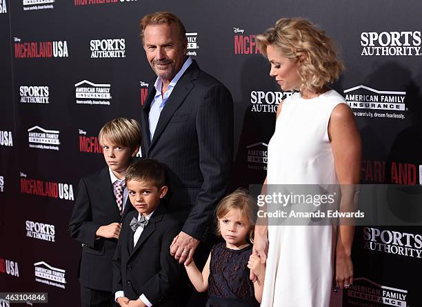 Actor Kevin Costner, his wife Christine Baumgartner and their children arrive at the world premiere of Disney's "McFarland, USA" at the El Capitan...