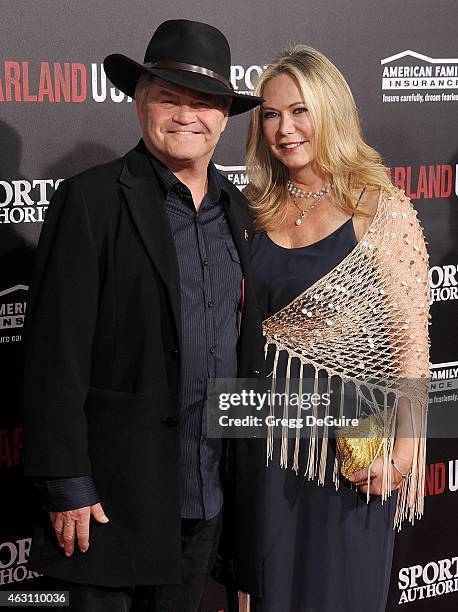 Actor/musician Micky Dolenz and Donna Quinter arrive at the World Premiere of Disney's "McFarland, USA" at the El Capitan Theatre on February 9, 2015...