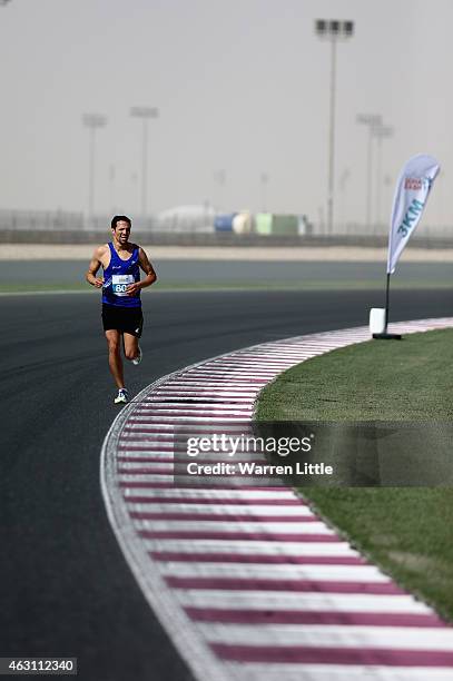 Mounier Bouzaiane of France en route to winning the Men's 5Km during the Dolphin Energy Doha Dash at Losail Circuit on February 10, 2015 in Doha,...