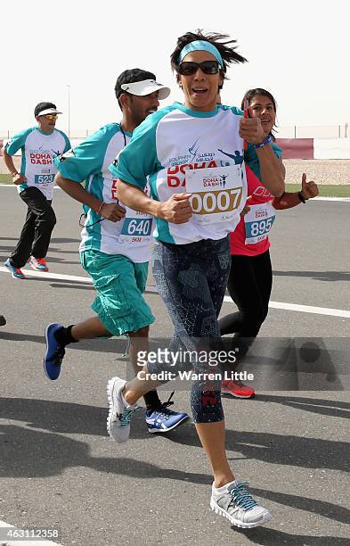 Dame Kelly Holmes of Great Britain runs the 5 Km race during the Dolphin Energy Doha Dash at Losail Circuit on February 10, 2015 in Doha, Qatar....