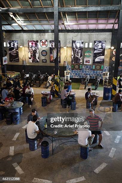 Expats and tourists enjoy hanging out in ManShed Cafe, Sanur. The ManShed cafe in Sanur, Bali is themed on an old style garage and is full of...