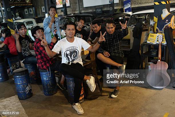 Local band Bali, Seven Ceblock posing for photo session after entertain visitors at ManShed Cafe, Sanur. The ManShed cafe in Sanur, Bali is themed on...
