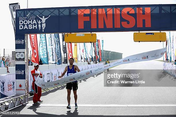 Mounier Bouzaiane of France wins the Men's 5km race during the Dolphin Energy Doha Dash at Losail Circuit on February 10, 2015 in Doha, Qatar. Taking...