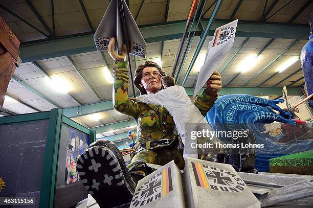 Stefan Wolleck works at the Carnival parade float satirizing the German minister of defence Ursula von der Leyern under the motto 'Ready for...