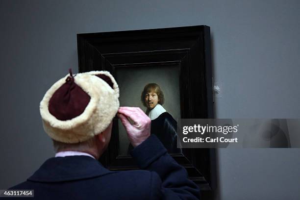 Visitor views a painting at the Dulwich Picture Gallery on February 10, 2015 in London, England. Working with U.S artist Doug Fishbone the gallery is...