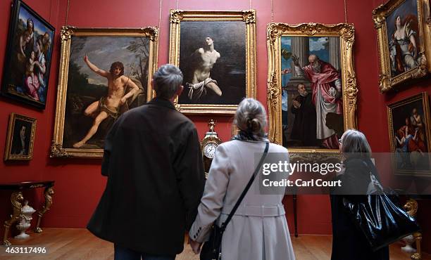 Visitors view paintings at the Dulwich Picture Gallery on February 10, 2015 in London, England. Working with U.S artist Doug Fishbone the gallery is...