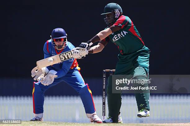 Steve Tikolo of Kenya plays a shot in front of wicketkeeper JP Kotze of Namibia during an ICC World Cup qualifying match between Namibia and Kenya on...