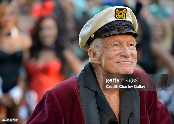 Hugh Hefner poses at Playboy's 60th Anniversary special event on January 16, 2014 in Los Angeles, California.