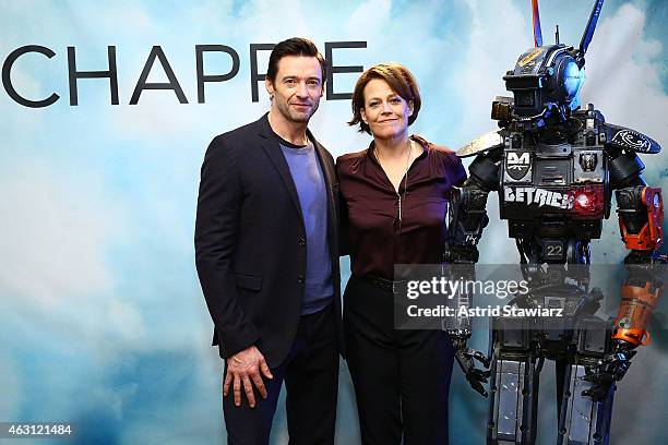 Actors Hugh Jackman and Sigourney Weaver attend the "Chappie" photo call at Crosby Street Hotel on February 10, 2015 in New York City.