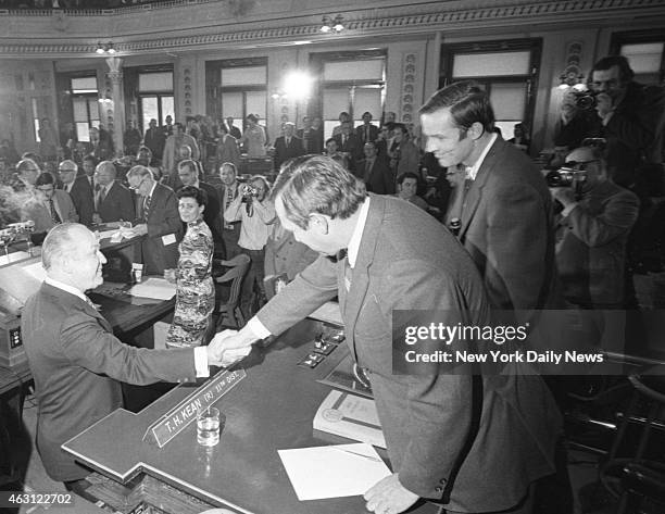 State House Trenton, N. J. Gov. William Cahill shakes hands with Senate President Raymond Bateman as Assembly speaker Tom Kean looks on before...