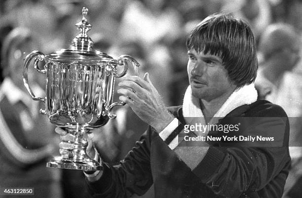 Jimmy Connors holds cup after beating Czech ace Ivan Lendl, 6-3, 6-2, 4-6, 6-4, to win the U.S. Open in Flushing Meadows, Queens. It was Connors...
