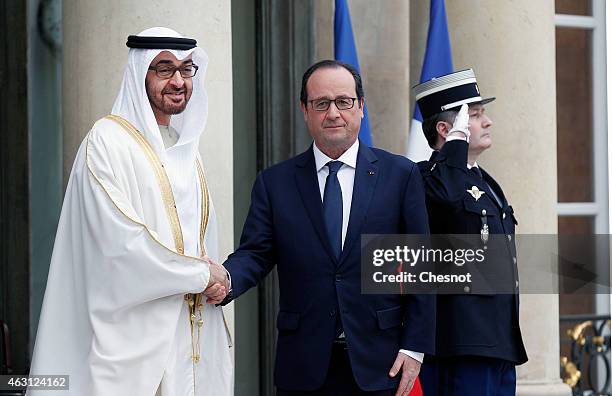 French President Francois Hollande welcomes Mohammed Bin Zayed Al Nahyan, the crown Prince of Abu Dhabi prior a meeting at the Elysee Palace on...