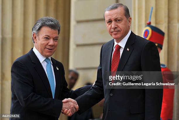 Turkish president Recep Tayyip Erdoga shakes hands with Juan Manuel Santos president of Colombia at Narino Presidential Palace during a two days...