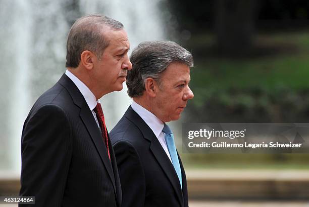 Turkish president Recep Tayyip Erdoga walks next to Juan Manuel Santos president of Colombia upon he arrives at Narino Presidential Palace for a...