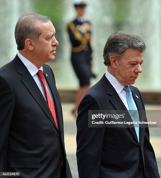 Turkish president Recep Tayyip Erdoga walks next to Juan Manuel Santos president of Colombia upon he arrives at Narino Presidential Palace for a...