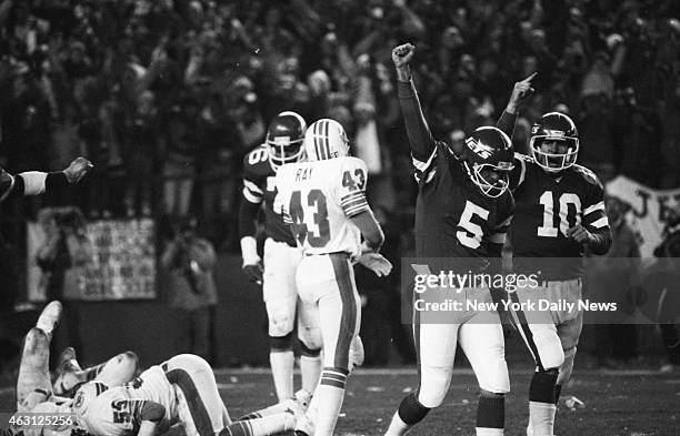 Football New York Jets v Miami Dolphins at Shea Stadium. After kicking winning conversion, Pat Leahy and holder Pat Ryan toast Jets' dramatic climb...