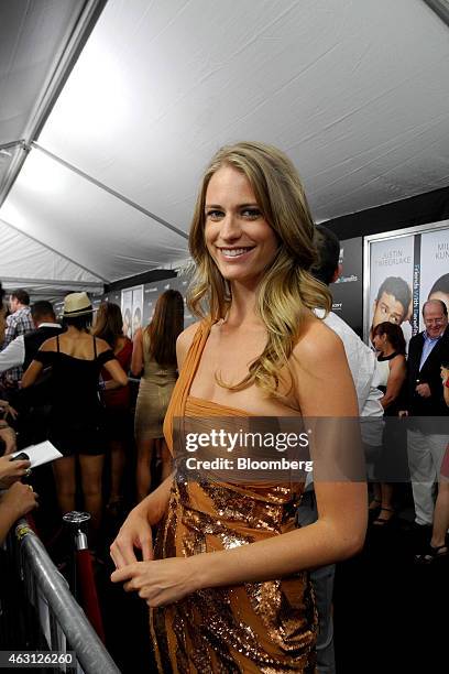 Sports Illustrated swimsuit model Julie Henderson stands for a photograph during an event in New York, U.S., on Monday, July 18, 2011. Photographer:...