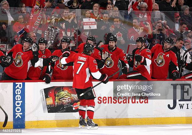 Kyle Turris of the Ottawa Senators celebrates his second period goal with team mates Colin Greening, Zack Smith, Erik Condra, Matt Kassian, Jason...