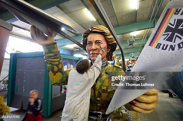 Stefan Wolleck works at the Carnival parade float satirizing the German minister of defence Ursula von der Leyen themed 'Ready for Take-Off' on...