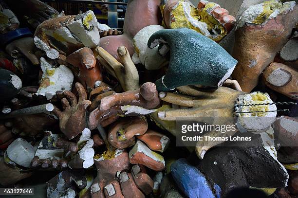 Hands of Old Carnival sculptures lie in a corner of the MCV Carnival club work shop while the MCV members present the new parade floats for Rose...