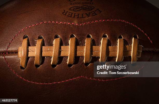 Detailed view of the laces and leather surface of a vintage football on November 28, 2014 in London, Ontario, Canada.