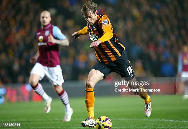 Nikica Jelevic of Hull City scores the opening goal during the Barclays Premier League match between Hull City and Aston Villa at the KC Stadium on...