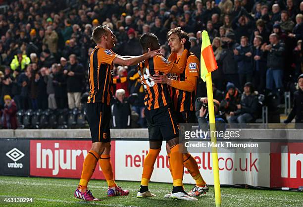 Nikica Jelevic of Hull City is congratulated by teammates Dame N'Doye and David Meyler of Hull City after scoring the opening goal during the...