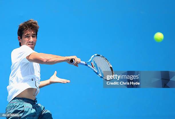 Marc Lopez of Spain plays a forehand in his second round doubles match with Marcel Granollers of Spain against Max Mirnyi of Belarus and Mikhail...