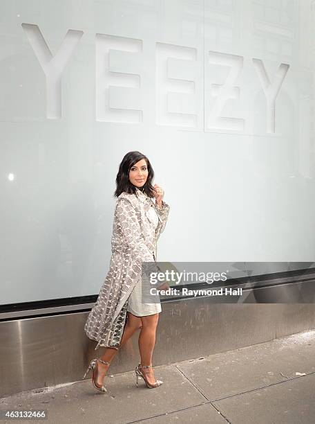 Kim Kardashian is seen at a photoshoot outside the Adidas Store in Soho where the new Kanye West Adidas Originals 'Yeezy Boost' sneakers are on...