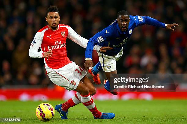 Jeffrey Schlupp of Leicester City battles for the ball with Francis Coquelin of Arsenal during the Barclays Premier League match between Arsenal and...