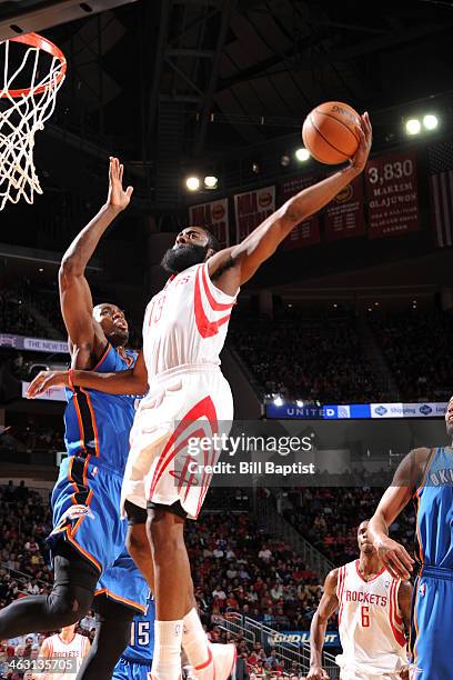 James Harden of the Houston Rockets dunks the ball against the Oklahoma City Thunder on January 16, 2014 at the Toyota Center in Houston, Texas. NOTE...